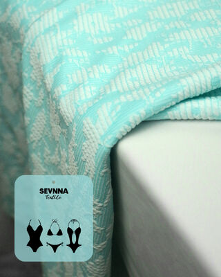 Kain renang bertekstur premium dengan lebar 135cm lebar 195gsm berat dan 50% komposisi poliester daur ulang